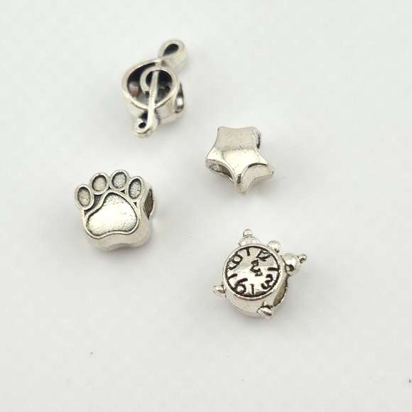 4-Piece Mixed Silver Tone Bead Set: Clock, Paw Print, Music Note, Star - Picture 1 of 2